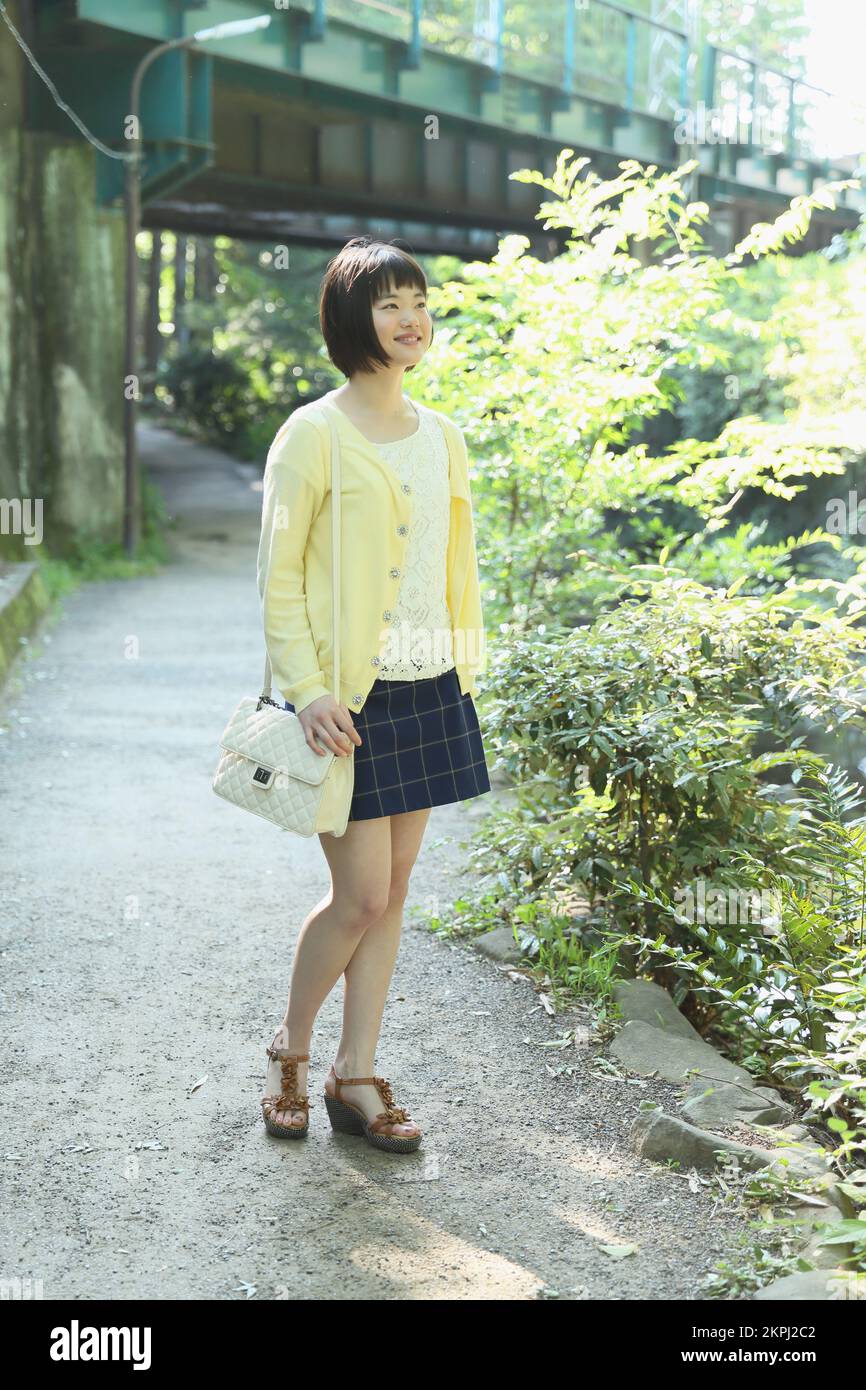 Young Japanese woman taking a walk Stock Photo - Alamy