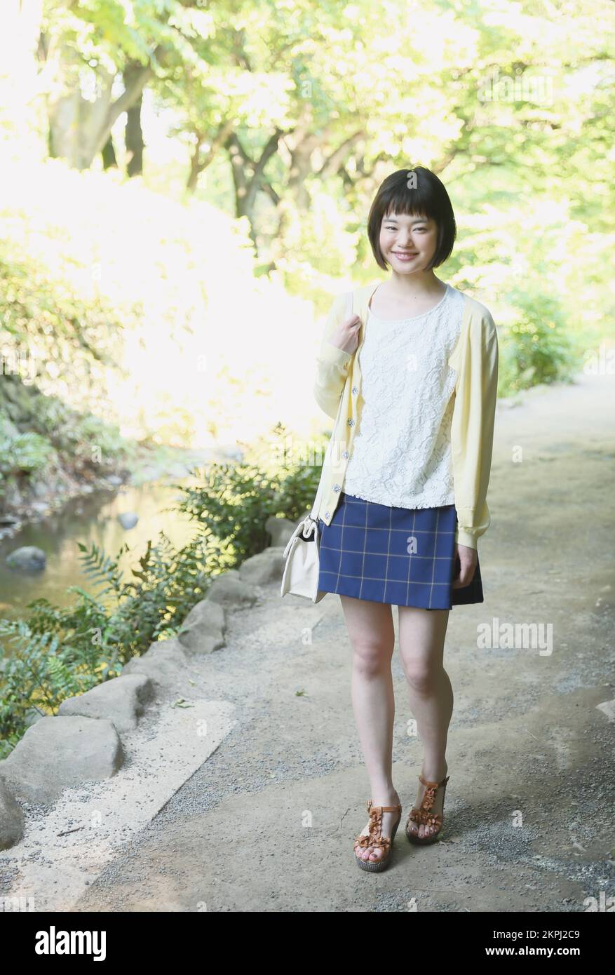 Young Japanese woman taking a walk Stock Photo - Alamy