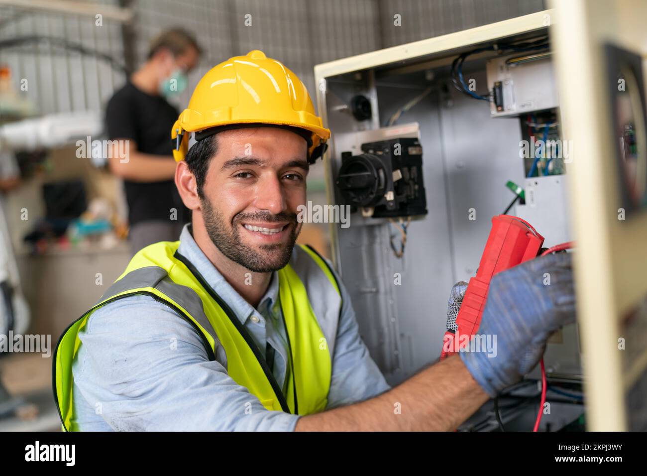 Robotics engineer working on maintenance of modern robotic arm in