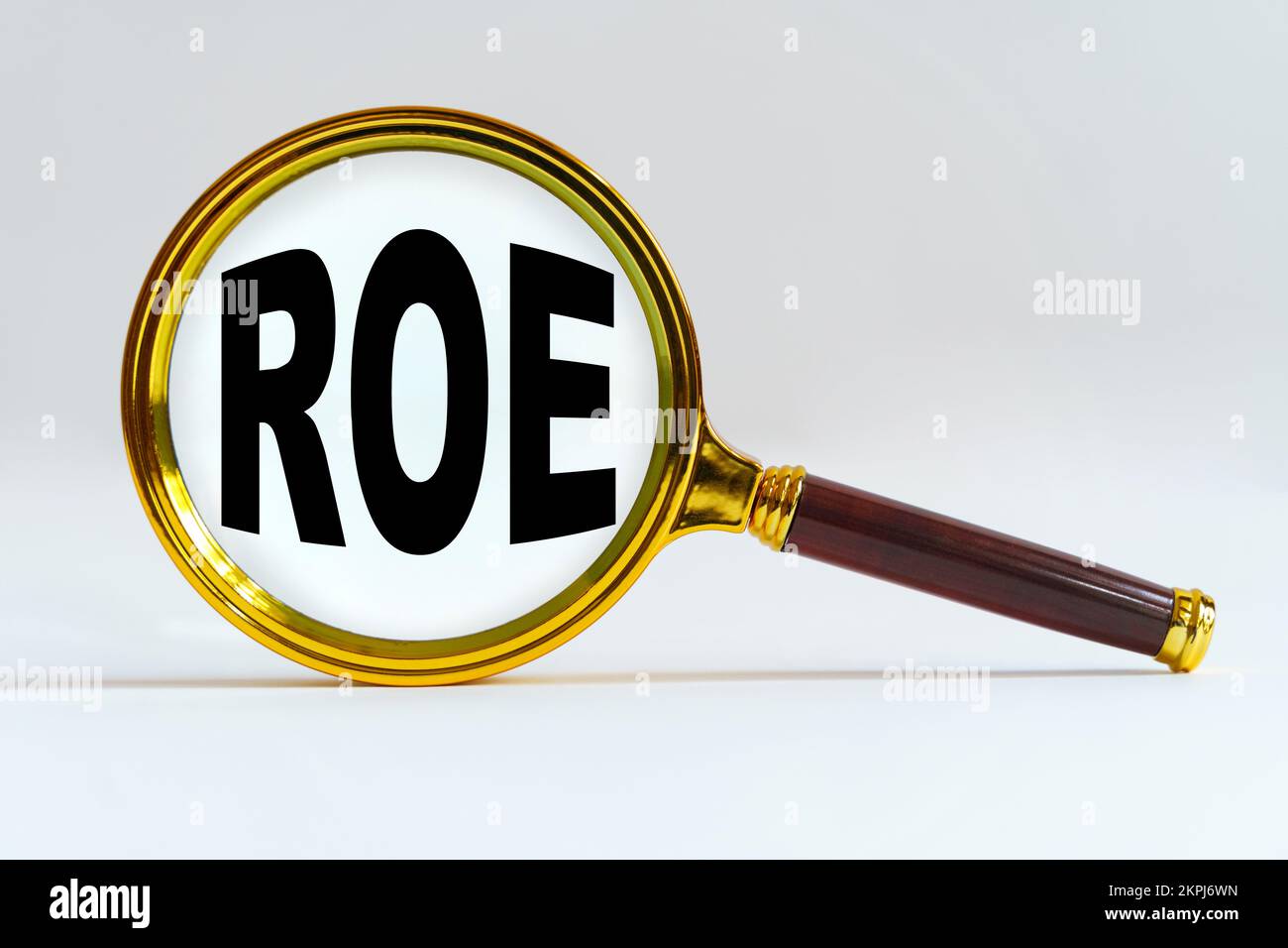 Finance and economics concept. Magnifier on a white background, inside ...