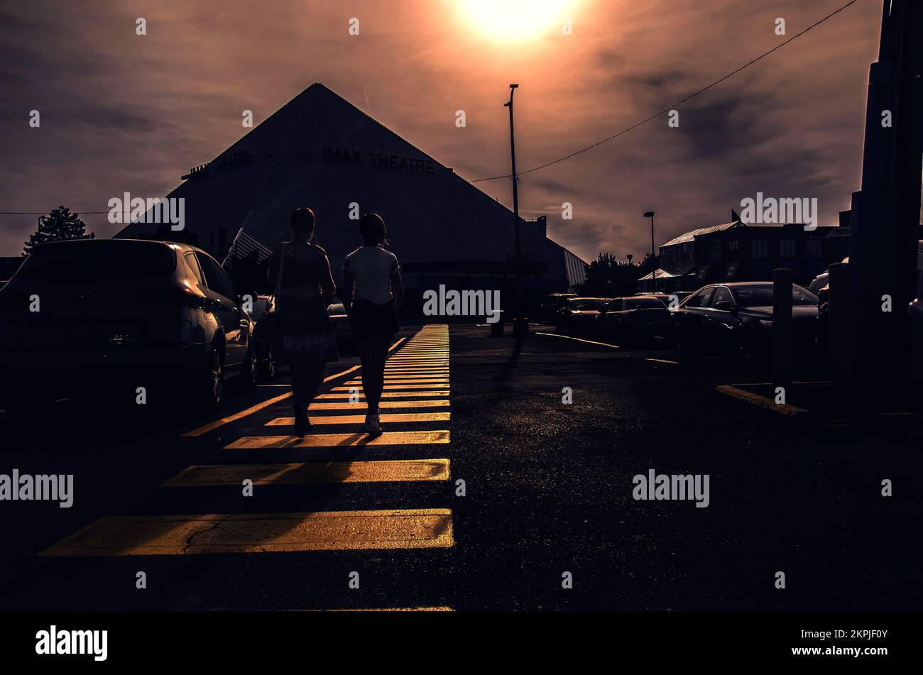 Two girls crossing the street Stock Photo - Alamy