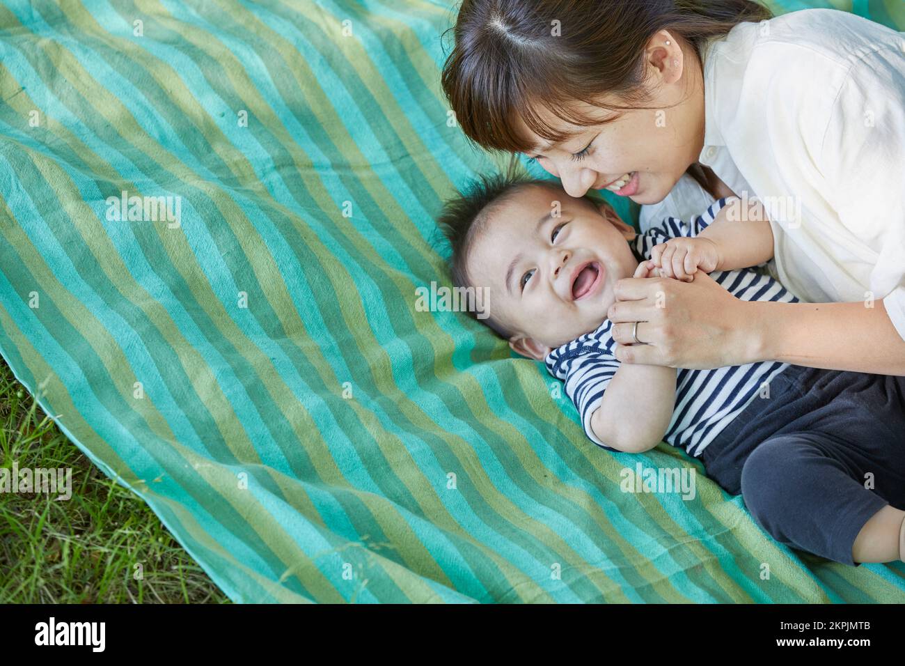 Japanese mother cuddling with her baby Stock Photo