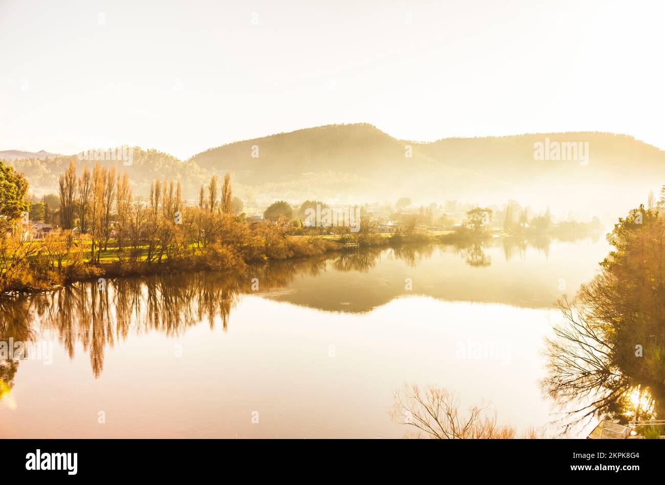 Beauty in Tasmania captured in a landscape of early tranquillity with river views and morning fog. Derwent River, New Norfolk, Australia Stock Photo