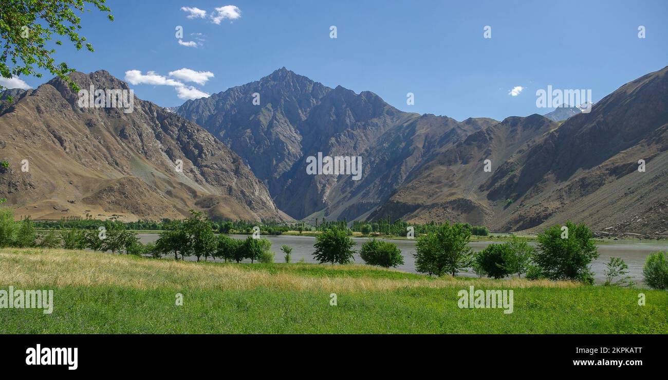 Mountain landscape view of Panj river valley, border between Tajikistan and Afghanistan, near Khorog, Gorno-Badakshan, Tajikistan Pamir Stock Photo