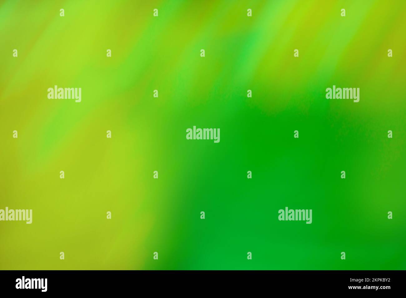 Pistachio color blur bokeh. Abstract green blurred gradient background with light. Stock Photo