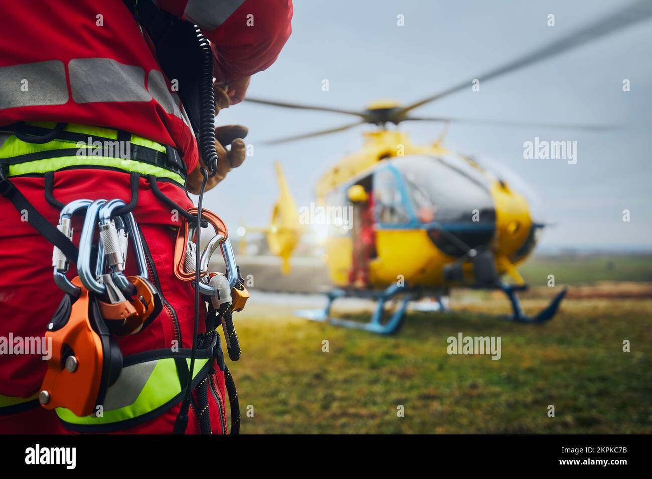 Selective focus on safety harness of paramedic of emergency service in