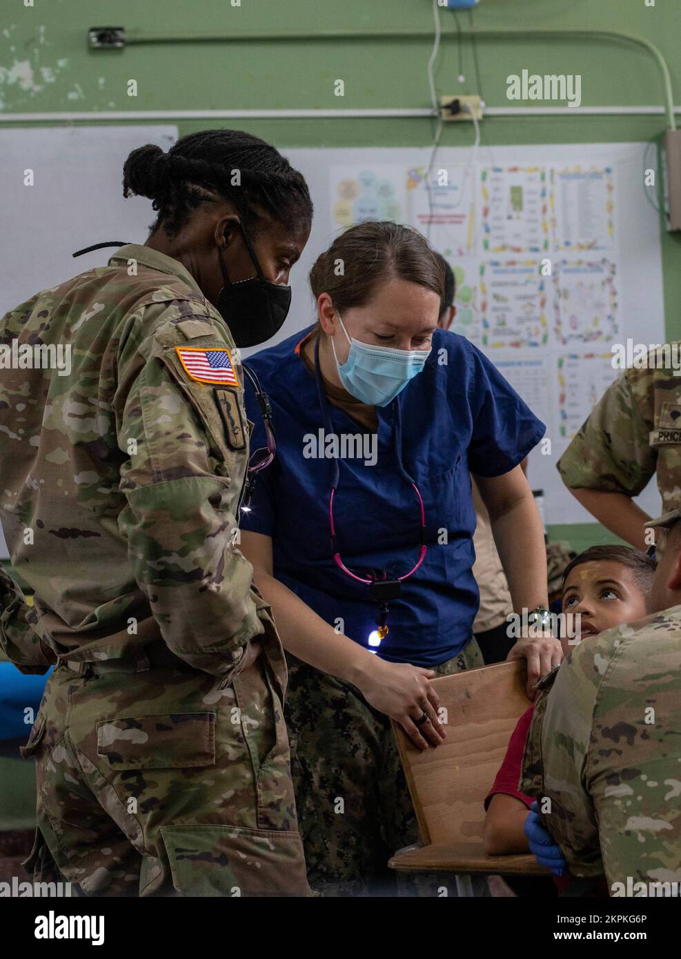 Navy Lt. Cmdr. Amie Heim, a pediatric dentist from Buffalo, New York and Army Lt. Col. Callief Shand, a general dentist assigned to Joint Task Force Bravo (JTF-B) perform dental care on a patient at a medical site in Tegucigalpita, Honduras during Continuing Promise 22, Nov. 1, 2022. CP22 is a humanitarian assistance and goodwill mission conducting direct medical care, expeditionary veterinary care, and subject matter expert exchanges with five partner nations in the Caribbean, Central and South America. Stock Photo