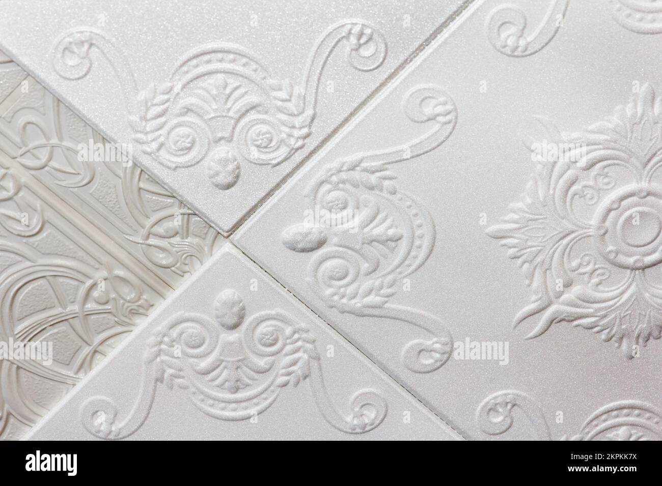 Ceiling repair, easy way. New molded foam sheets with beautiful pattern, stick on top of old plastic thin slabs Stock Photo