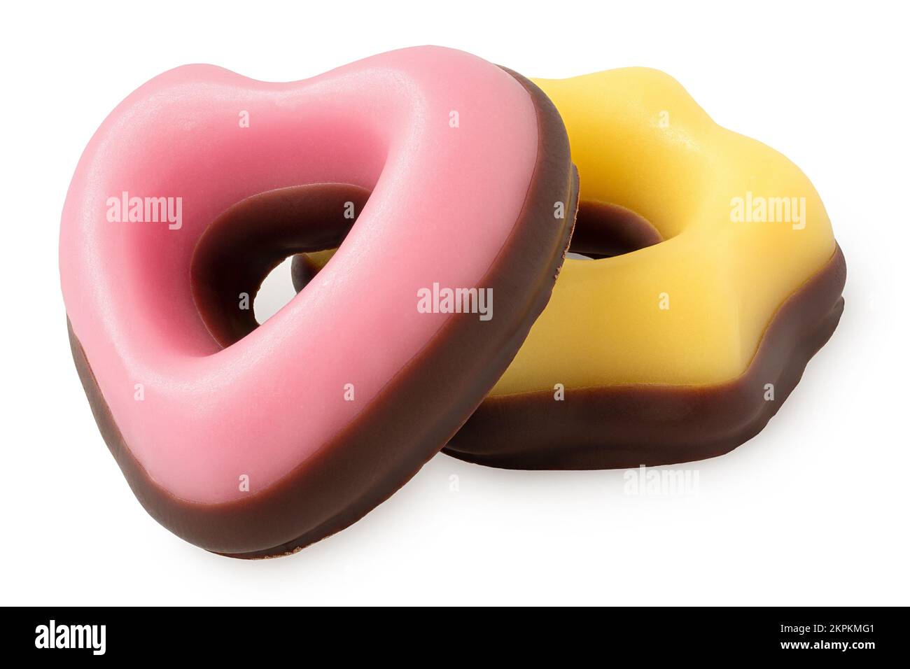 Yellow and pink christmas fondant sweets dipped in chocolate isolated on white. Stock Photo