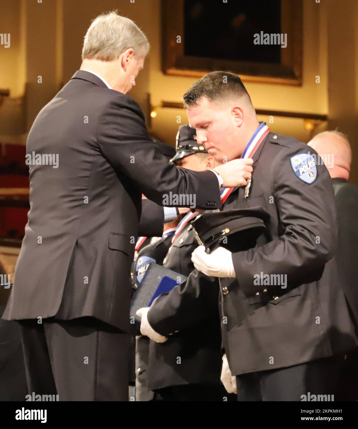 WORCESTER, Mass. – Sgt. Scott Morin, a water treatment specialist of the 125th Quartermaster Company, Massachusetts National Guard, and a Worcester Police Officer, receives Medal of Honor during the 39th Annual Trooper George L. Hanna Memorial Awards for Bravery Ceremony at Mechanics Hall, Nov. 1, 2022. The awards were presented by Massachusetts Governor Charlie Baker, Lieutenant Governor Karyn Polito, Security Secretary Terrence Reidy, and family members of Trooper Hanna.   (Massachusetts National Guard photo by Sgt. 1st Class Laura Berry) Stock Photo