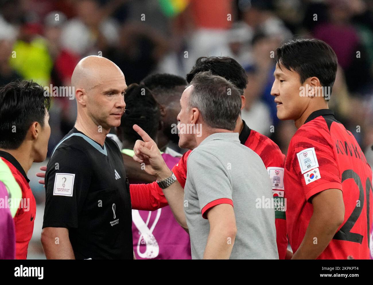 Al Rayyan, Qatar. 28th Nov, 2022. Paulo Bento (R, front), head coach of South Korea, reacts after receiving a red card from referee Anthony Taylor (2nd L) during the Group H match between South Korea and Ghana at the 2022 FIFA World Cup at Education City Stadium in Al Rayyan, Qatar, Nov. 28, 2022. Credit: Li Gang/Xinhua/Alamy Live News Stock Photo