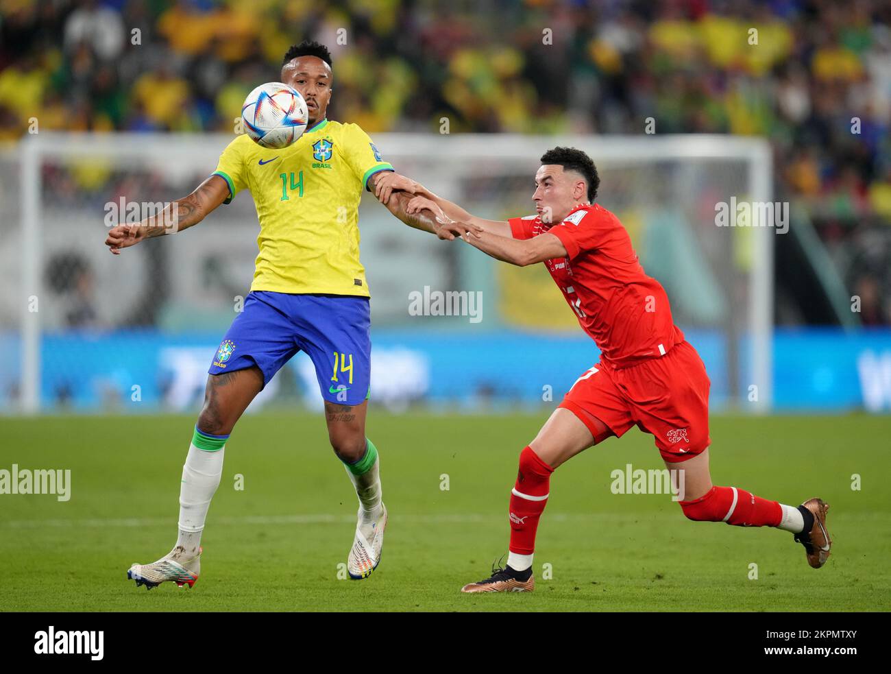 Brazil's Eder Militao (left) and Switzerland's Ruben Vargas battle for the ball during the FIFA World Cup Group G match at Stadium 974 in Doha, Qatar. Picture date: Monday November 28, 2022. Stock Photo