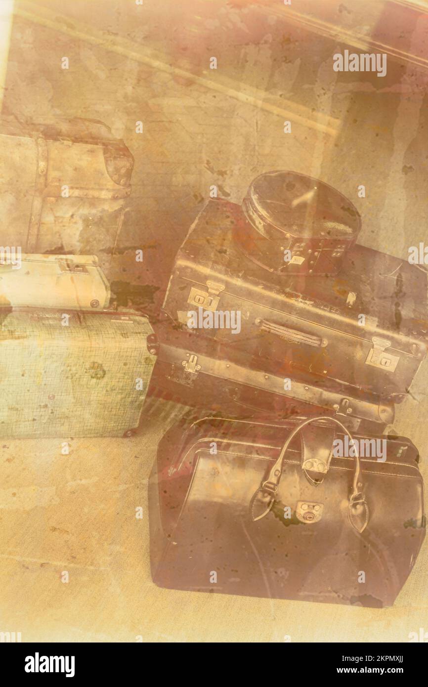 Old vintage photo on a stack of antique war time luggage reflected in the glass of a departure terminal. Nostalgic farewell Stock Photo