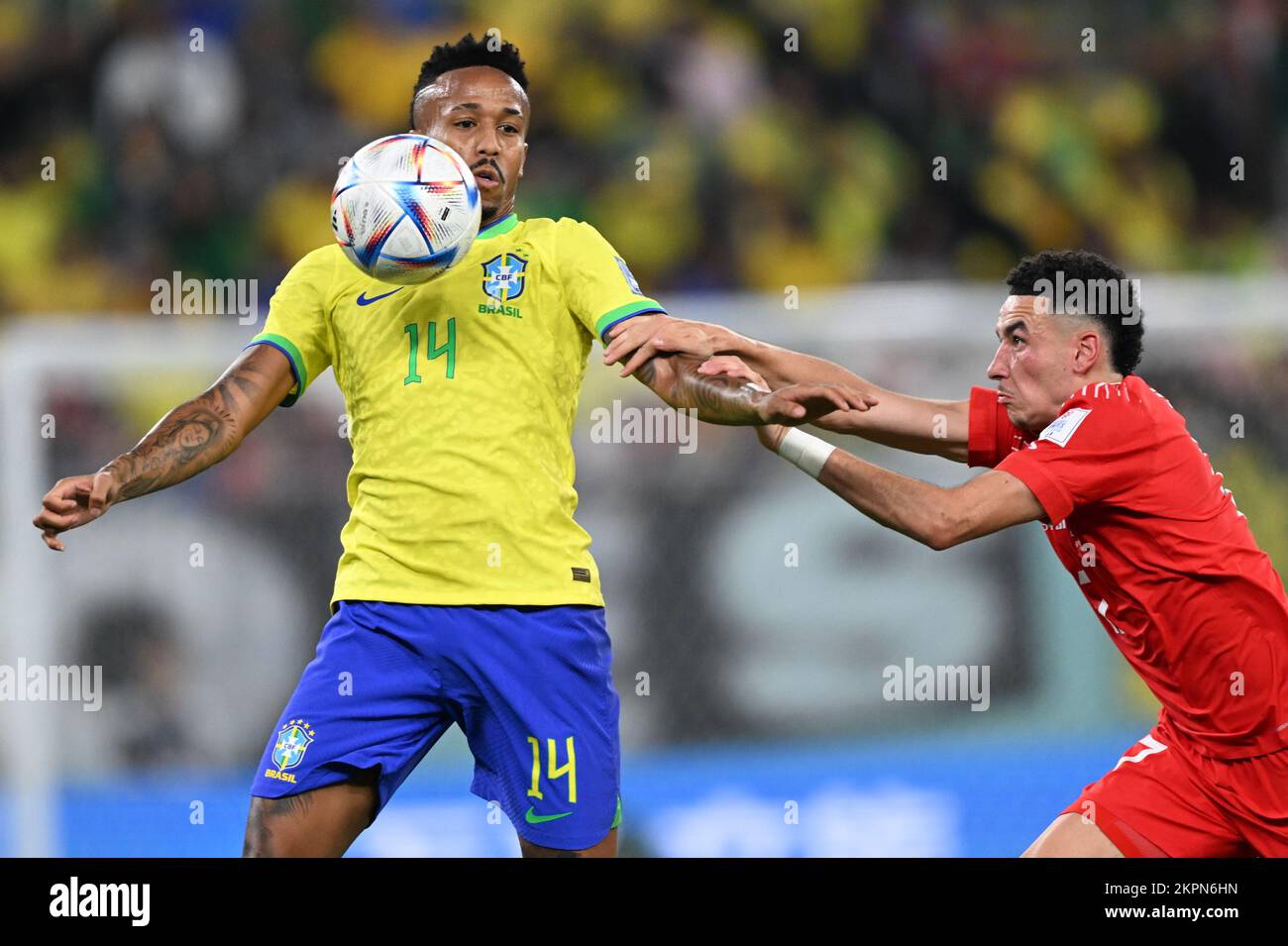 Doha, Qatar. 28th Nov, 2022. Soccer, World Cup 2022 in Qatar, Brazil - Switzerland, preliminary round, Group G, Matchday 2, at Stadium 974, Brazil's Éder Militao (l) is tackled by Switzerland's Ruben Vargas. Credit: Federico Gambarini/dpa/Alamy Live News Credit: dpa picture alliance/Alamy Live News Stock Photo