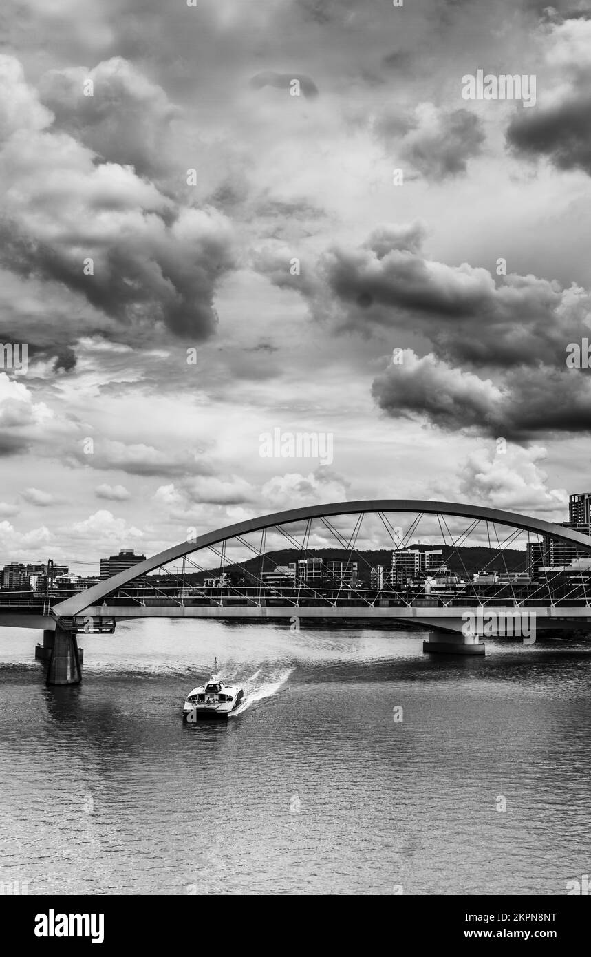 Beauty in grey with a atmospheric take of river ferries under rail bridges. Captured: Merivale Bridge, Brisbane City, Queensland, Australia Stock Photo