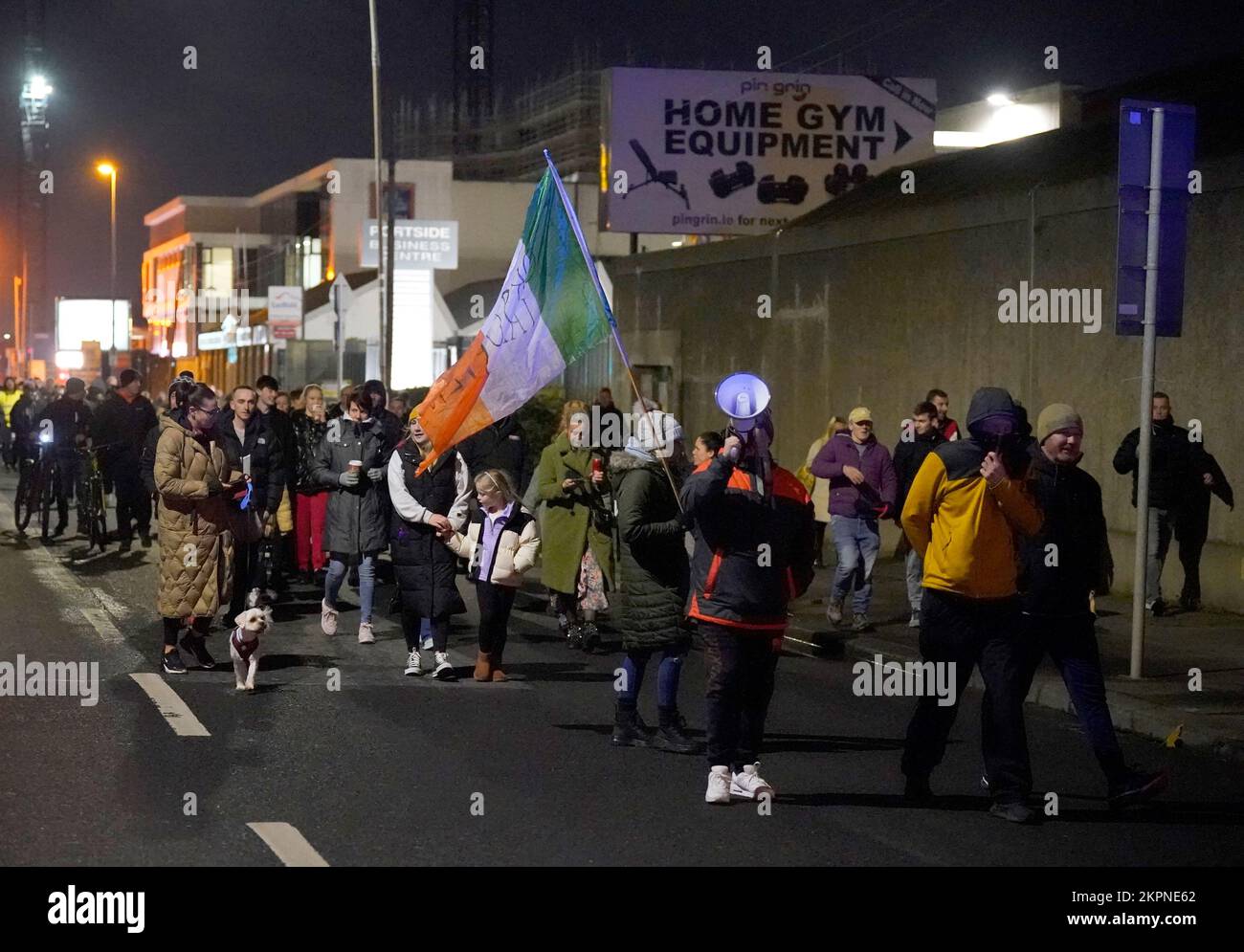 Members of the public march on Dublin Port following the housing of some 100 migrants at the former ESB office block in East Wall, Dublin which is being used as an emergency accommodation for refugees. Protesters and some residents claimed there was not enough consultation with locals ahead of the arrangement. Picture date: Monday November 28, 2022. Stock Photo