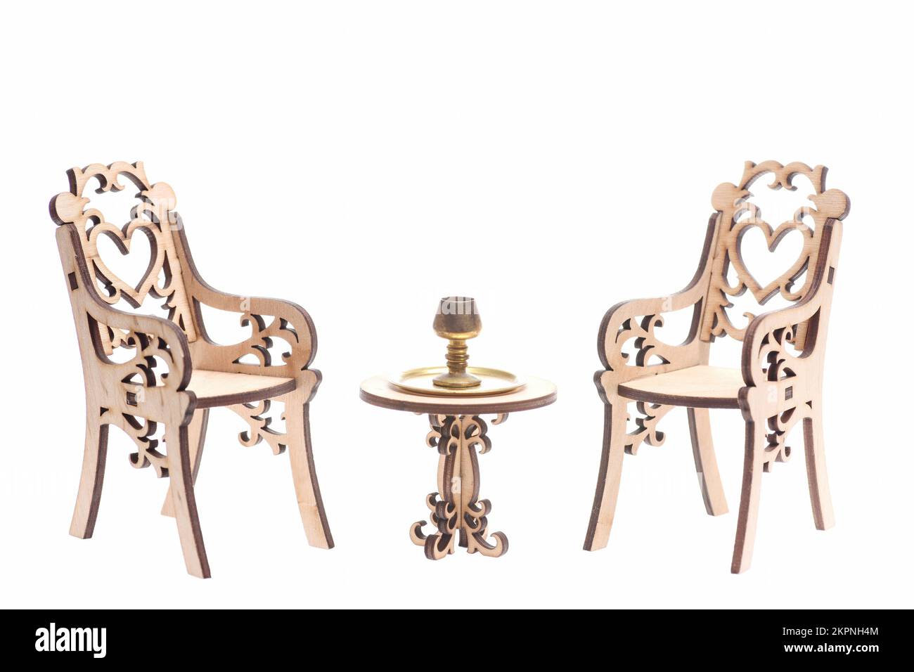 Chalice on golden stray on vintage table with chairs Stock Photo