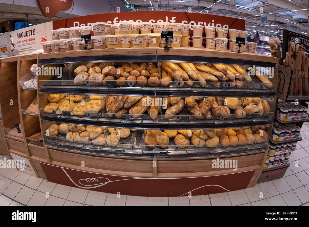 Cuneo, Italy November 22, 2022 shelf with different types of loaves of bread for self service