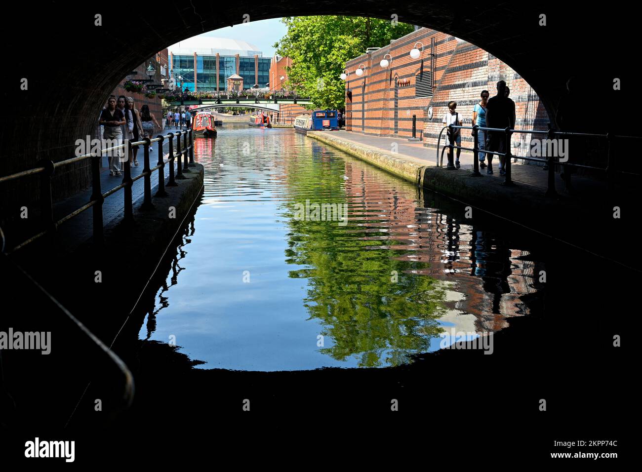 View from the tunnel below Black Sabbath Bridge  toward Gas St Basin in the centre of Birmingham's Canal system Stock Photo