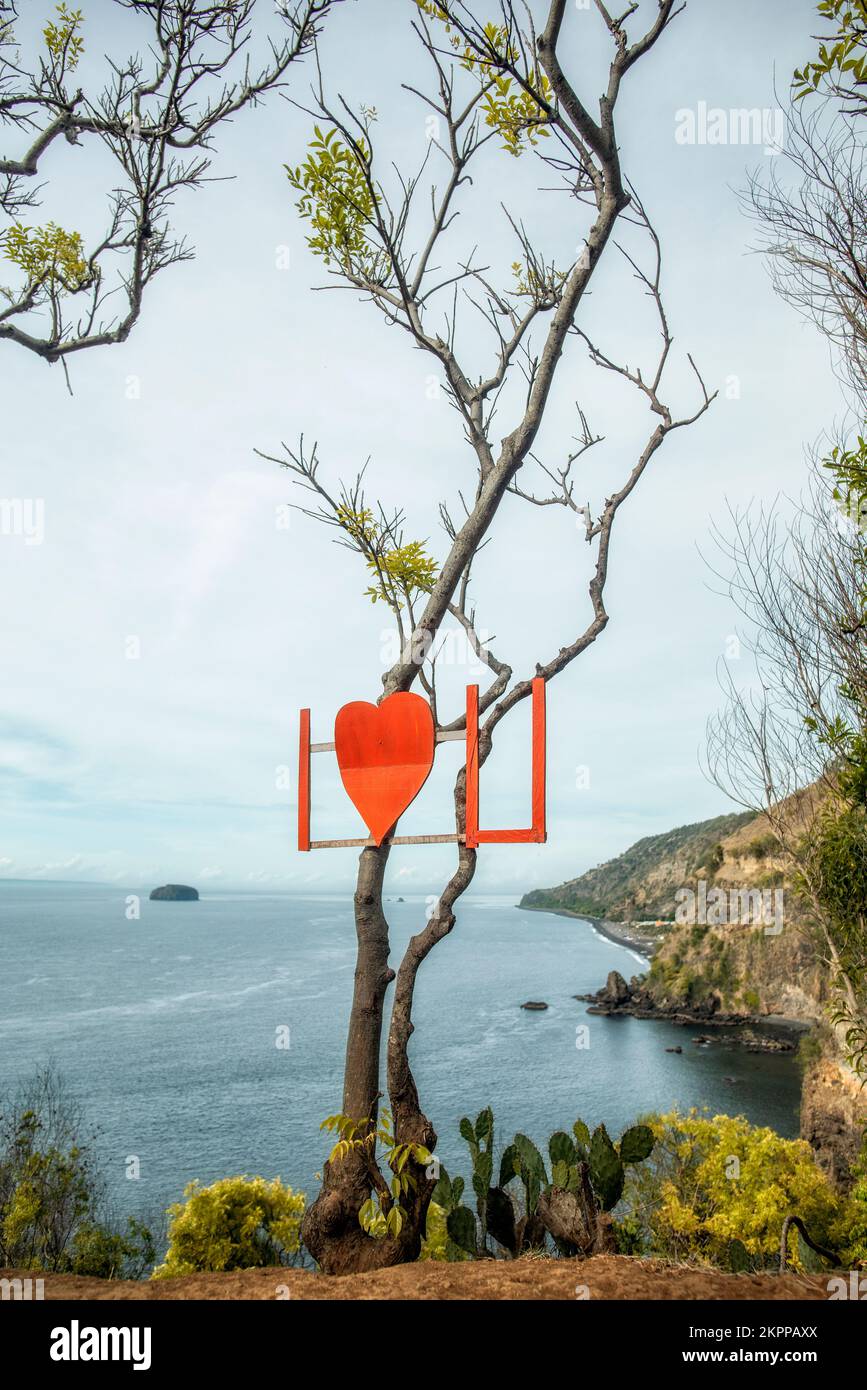 I love U sign on a tree on coastline, Bukit Asah Bugbug, Karangasem, Bali, Indonesia Stock Photo