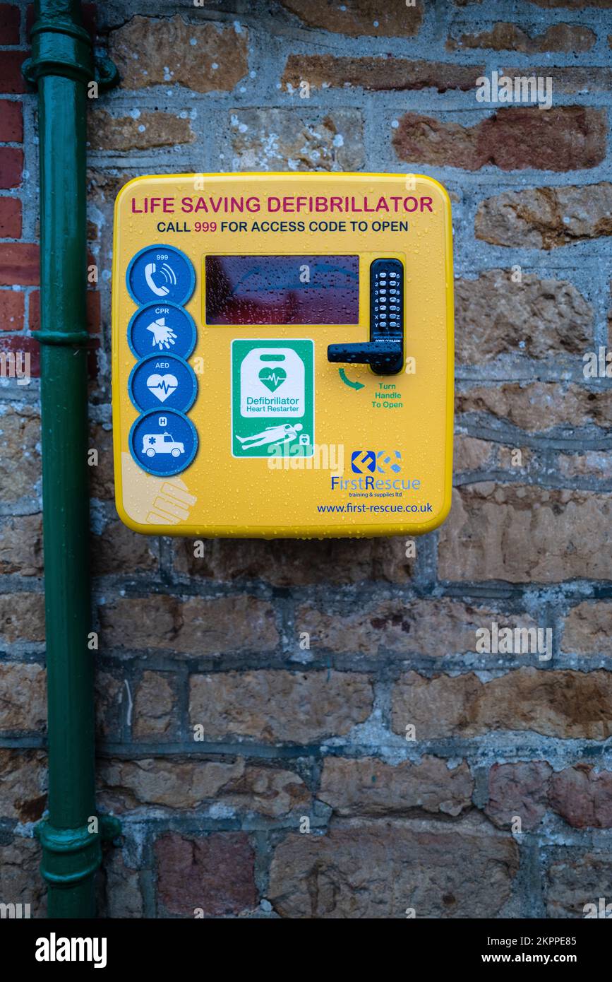 Automated External Defibrillator outside a pub in rural Dorset. Stock Photo