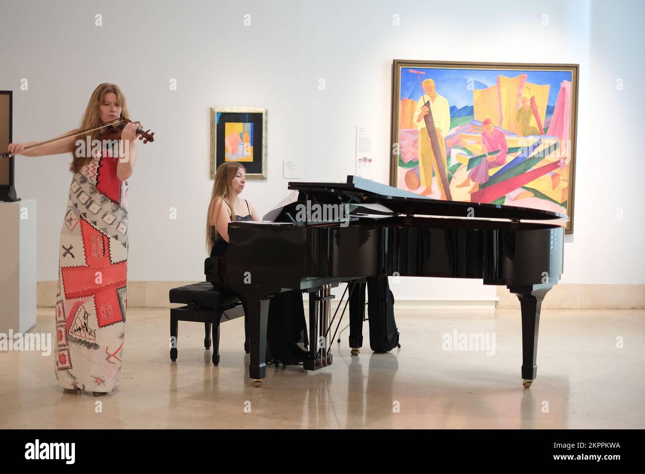 Madrid, Spain. 28th Nov, 2022. Ukrainian violinist Bhodana Pivnenko and pianist Anna Khmara (R) of 'Touch of Angel' musician group gesture during the exhibition 'In the Eye of the Hurricane' at the Museo Nacional Thyssen-Bornemisza in Madrid. (Photo by Atilano Garcia/SOPA Images/Sipa USA) Credit: Sipa USA/Alamy Live News Stock Photo