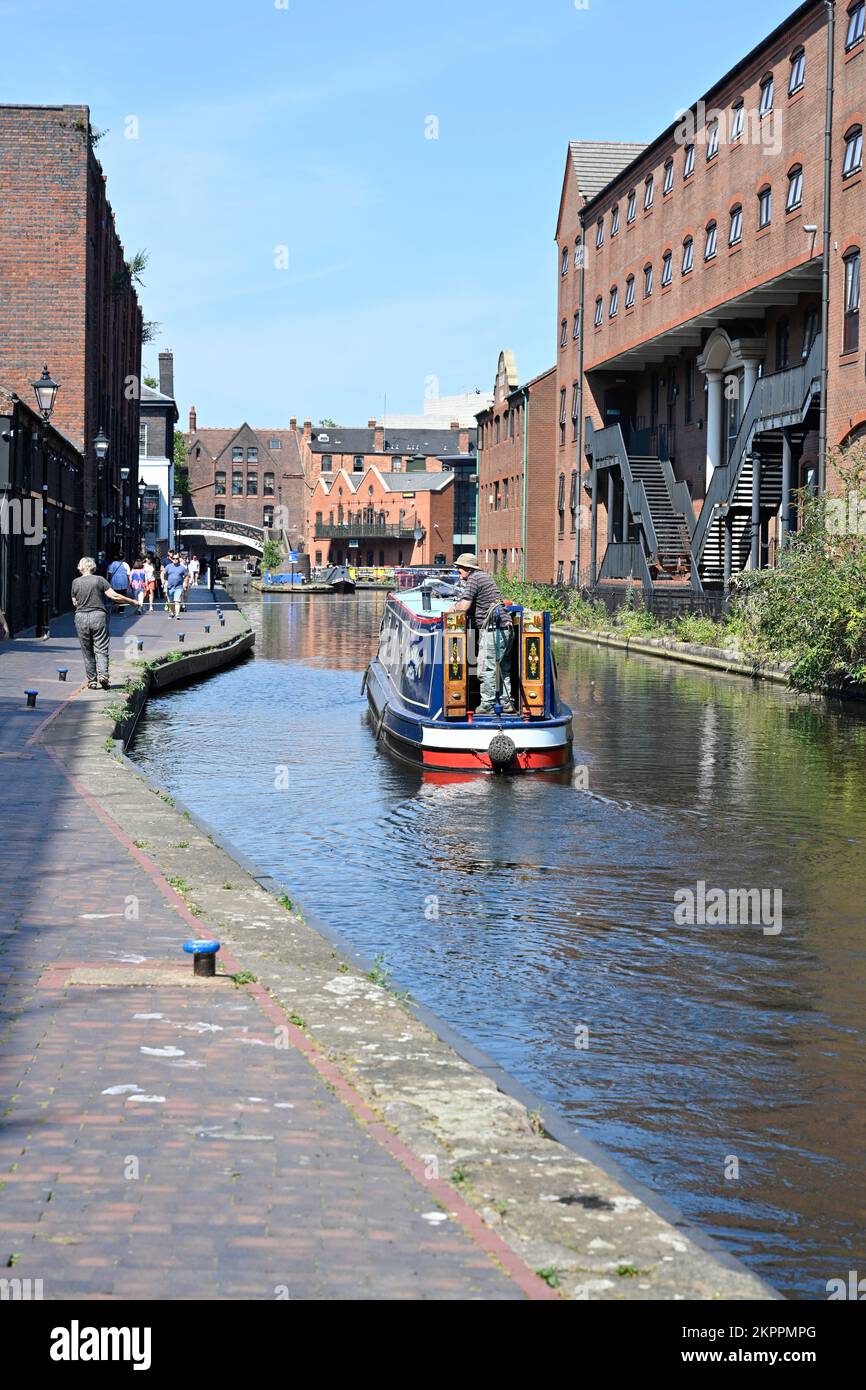 Canal barge heading for Gas St Basin in the centre of Birmingham UK Stock Photo