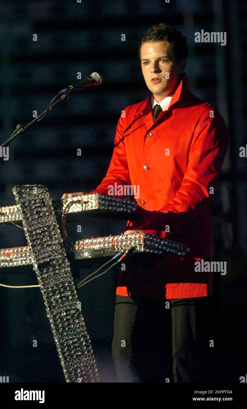 THE KILLERS singer BRANDON FLOWERS playing support to U2 at the Millennium Stadium in Cardiff, June 29 2005. Photograph: ROB WATKINS.  INFO: The Killers are an American rock band formed in Las Vegas in 2001. Known for their energetic sound and hits like 'Mr. Brightside,' they gained fame with their debut album 'Hot Fuss' and have remained influential in indie and alternative rock. Stock Photo