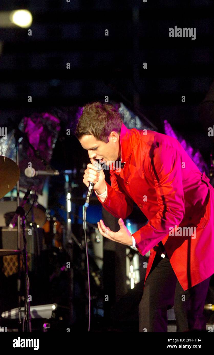 THE KILLERS singer BRANDON FLOWERS playing support to U2 at the Millennium Stadium in Cardiff, June 29 2005. Photograph: ROB WATKINS.  INFO: The Killers are an American rock band formed in Las Vegas in 2001. Known for their energetic sound and hits like 'Mr. Brightside,' they gained fame with their debut album 'Hot Fuss' and have remained influential in indie and alternative rock. Stock Photo