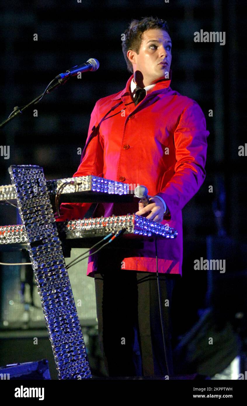 THE KILLERS singer BRANDON FLOWERS playing support to U2 at the Millennium Stadium in Cardiff, June 29 2005. Photograph: ROB WATKINS.  INFO: The Killers are an American rock band formed in Las Vegas in 2001. Known for their energetic sound and hits like 'Mr. Brightside,' they gained fame with their debut album 'Hot Fuss' and have remained influential in indie and alternative rock. Stock Photo