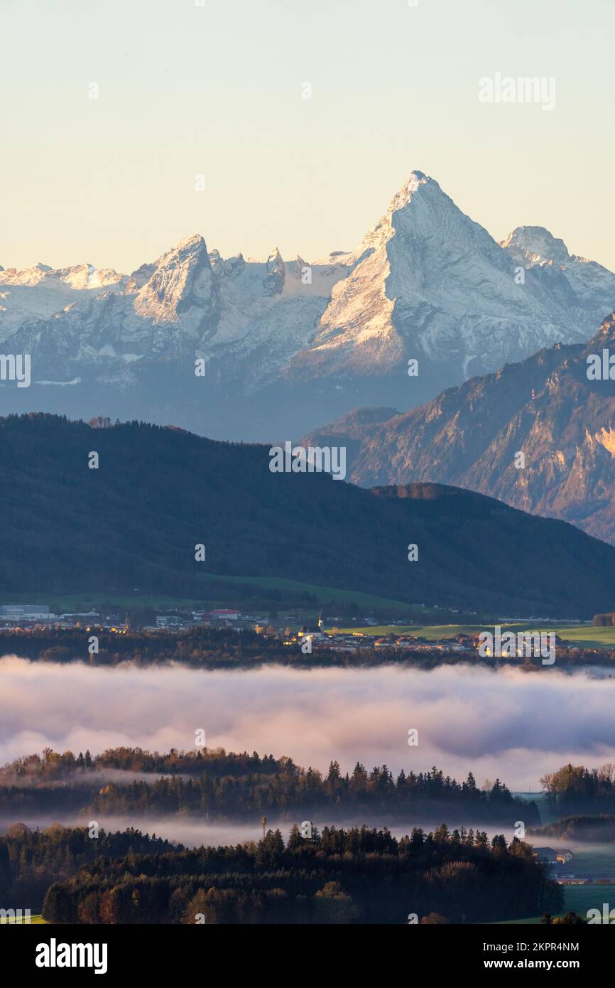 Low clouds over forest landscape with Mt Watzmann at dawn, Salzburg, Austria Stock Photo
