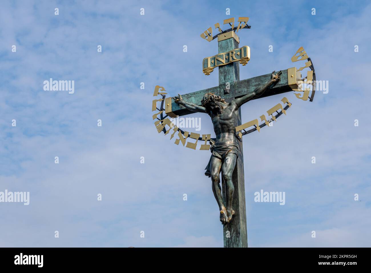 Jesus Christ on the cross on Charles Bridge in Prague Stock Photo