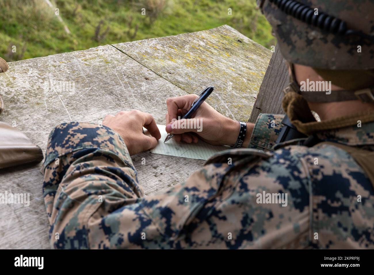 U.S. Marine Corps Lance Cpl. Edwin Fleming, a rifleman with 2nd Platoon, Alpha Company, Fleet Anti-terrorism Security Team, Marine Corps Security Force Regiment, draws the perimeter of a simulated forward operating base for a Marine Readiness Exercise (MRX) during Tartan Eagle phase II, near York, Europe, Nov. 2, 2022. An MRX is conducted prior to a deployment to ensure Marines are capable to execute essential mission objectives. Marines and British Royal Marines with 43 Commando Fleet Protection Group Royal Marines to travel to each other's training facilities to exchange tactics, techniques Stock Photo