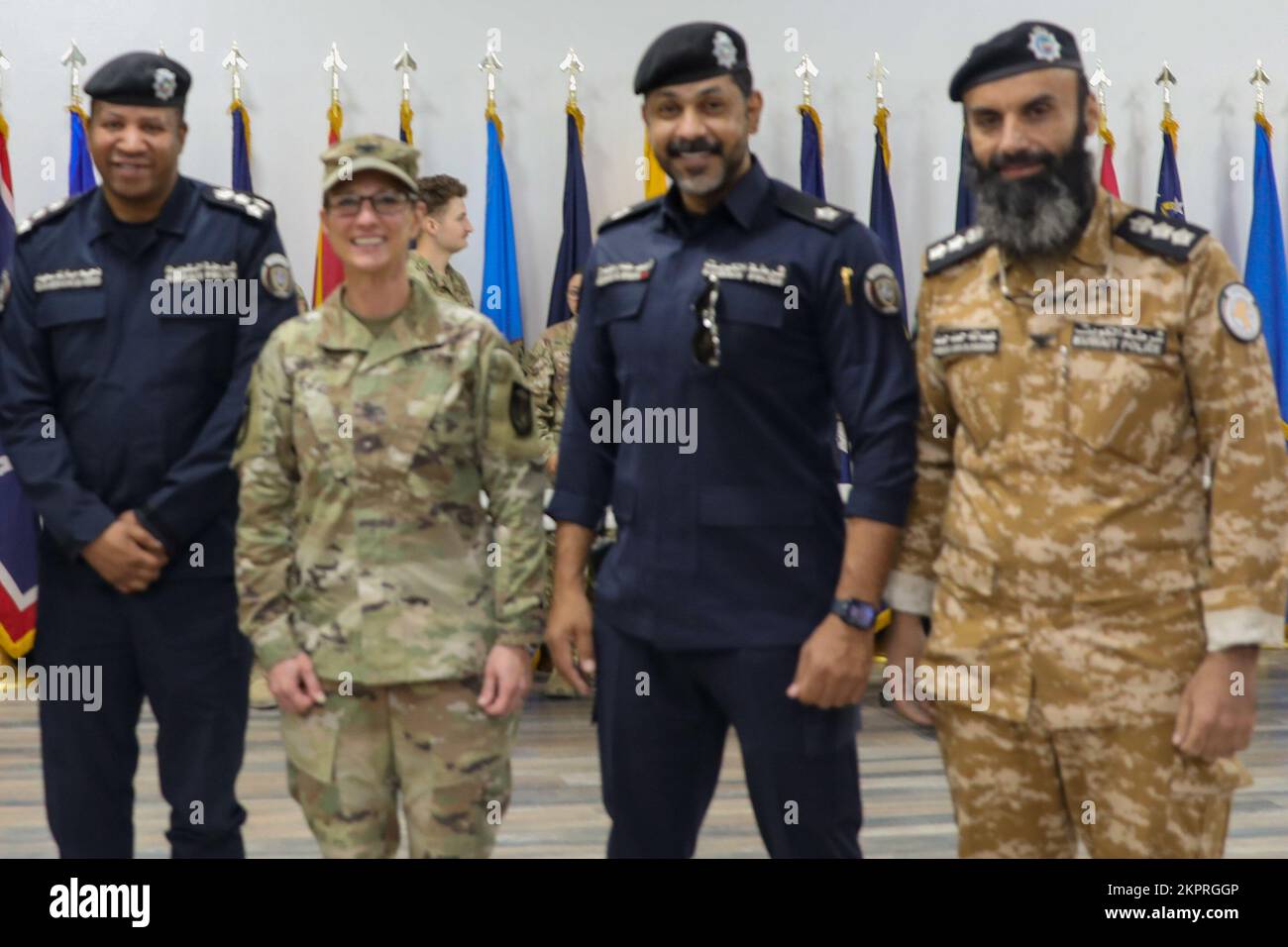 U.S. Army Col. Carrie Perez, the commanding officer of the 36th Sustainment Brigade, and Command Sgt. Maj. Ernest Castillo, the Brigade command sergeant major for the 36th SB, stand beside Kuwait leaders after a Transfer of Authority ceremony at the MWR theater on Camp Arifjan, Kuwait, Nov. 3, 2022. The 36th SB fostered a respectful working relationship with Kuwait leaders during their service in Kuwait. Stock Photo