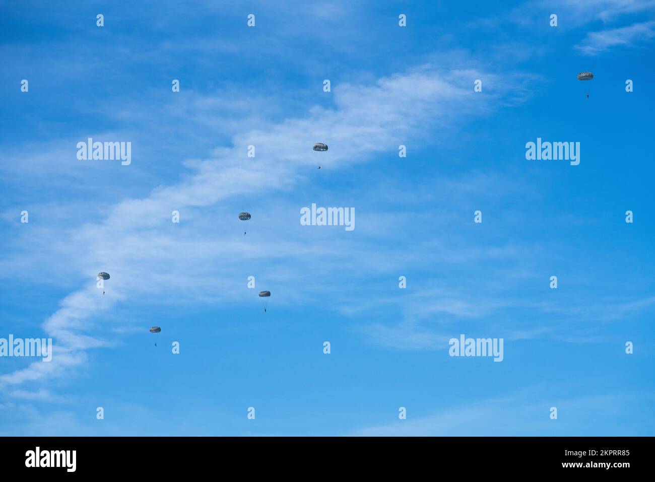 Members assigned to joint special operations forces jump out of a C-130J Hercules aircraft assigned to the 815th Airlift Squadron, Keesler Air Force Base, Mississippi, over MacDill Air Force Base, Florida, Nov. 3, 2022. Joint special operations forces members assigned to U.S. Special Operations Command, Special Operations Command Central and Joint Communications Support Element conducted an administrative non-tactical freefall operation over MacDill as part of a monthly training requirement. Stock Photo