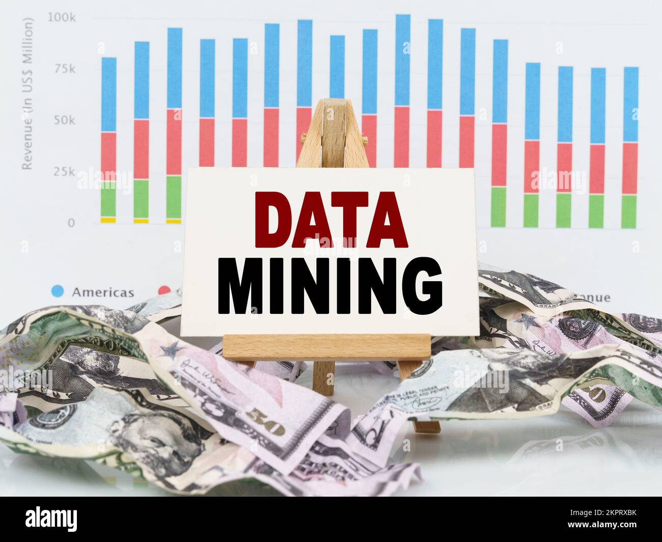 Business and finance concept. Among financial charts and money is a sign with the text - DATA MINING Stock Photo