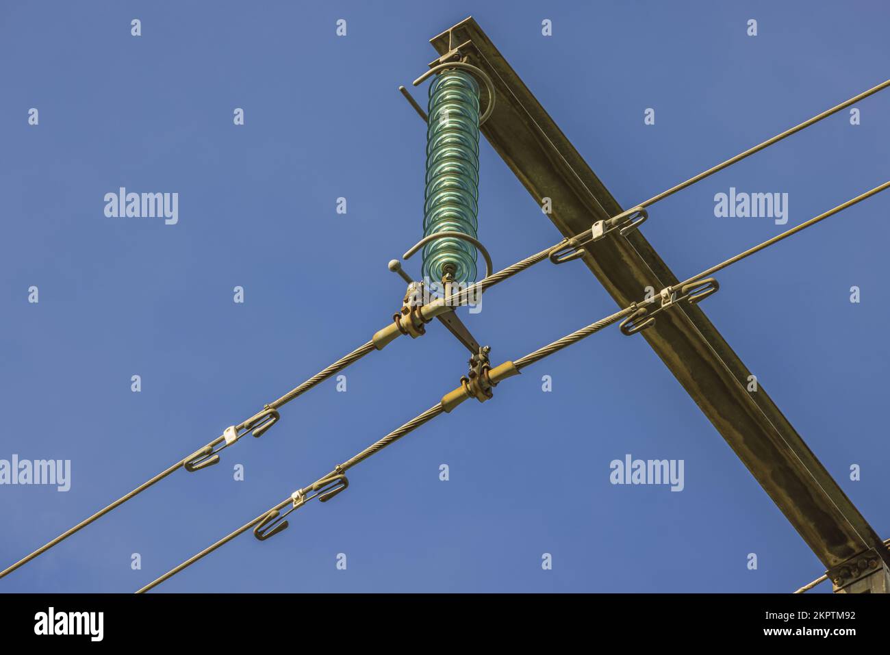 Close up view of highvoltage electric power transmission line on blue