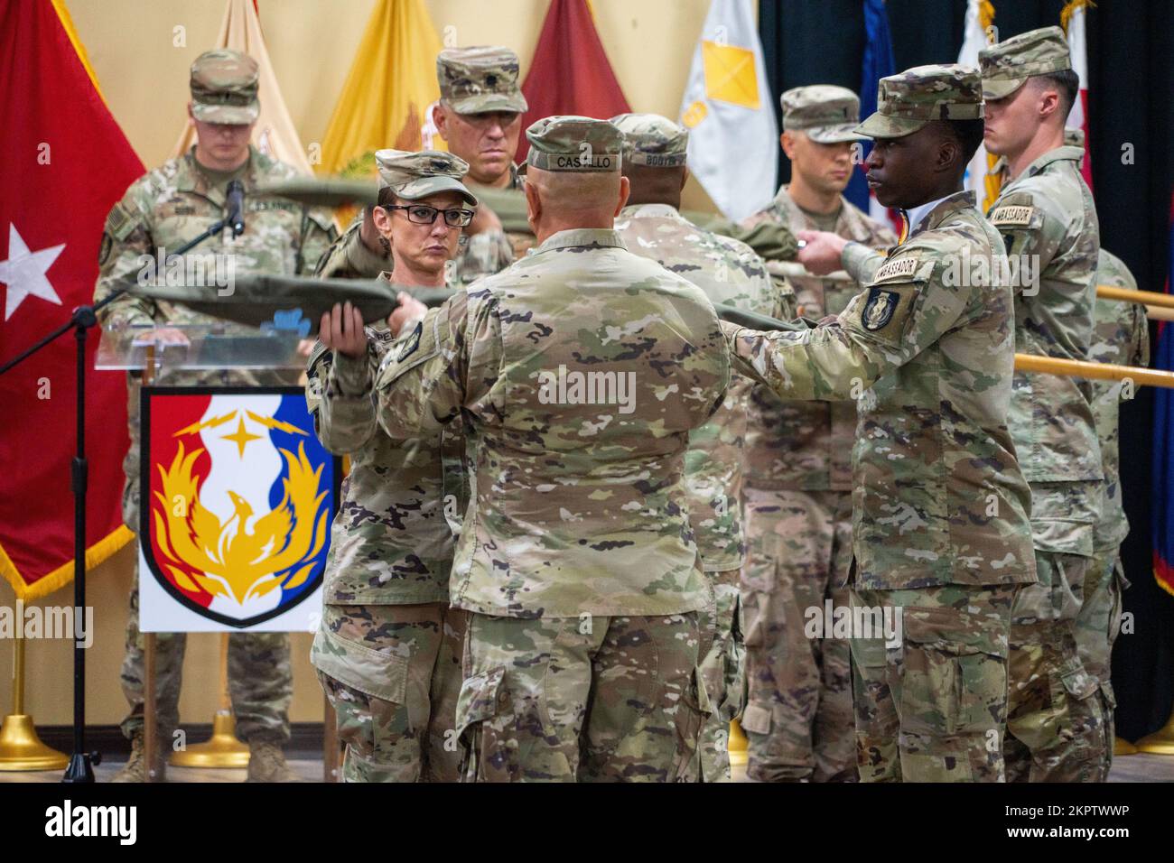 U.S. Army Col. Carrie Perez, commander of the 36th Sustainment Brigade and Command Sgt. Maj. Ernesto Castillo, senior enlisted advisor to Perez, case their brigade’s flag during a transfer of authority ceremony, Nov. 3, 2022, at Camp Arifjan, Kuwait. The transfer of authority ceremony signifies the end of the responsibilities of Task Force Phoenix followed by the assumption of responsibility by Task Force Hellfighter. Stock Photo