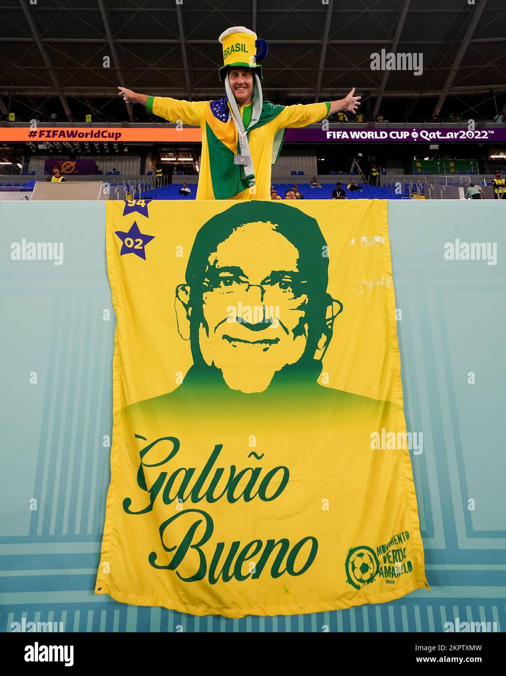 DOHA, QATAR NOVEMBER 28 Supporter of Brazil with a flag poses for a