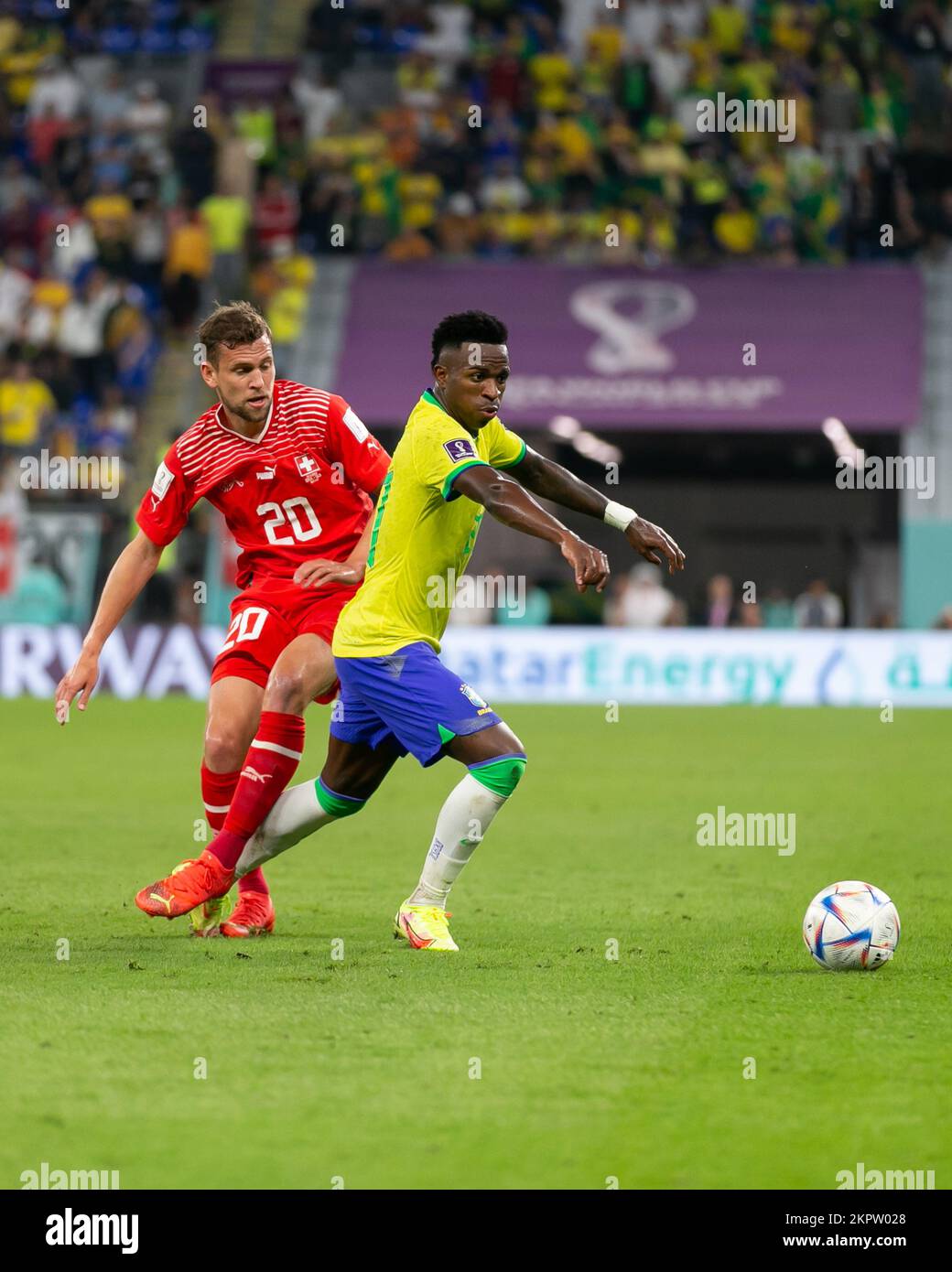 DOHA, QATAR - NOVEMBER 28: Player of Brazil Vinícius Júnior fights for the ball with player of Switzerland Fabian Frei during the FIFA World Cup Qatar 2022 group G match between Brazil and Switzerland at Stadium 974 on November 28, 2022 in Doha, Qatar. (Photo by Florencia Tan Jun/PxImages) Stock Photo