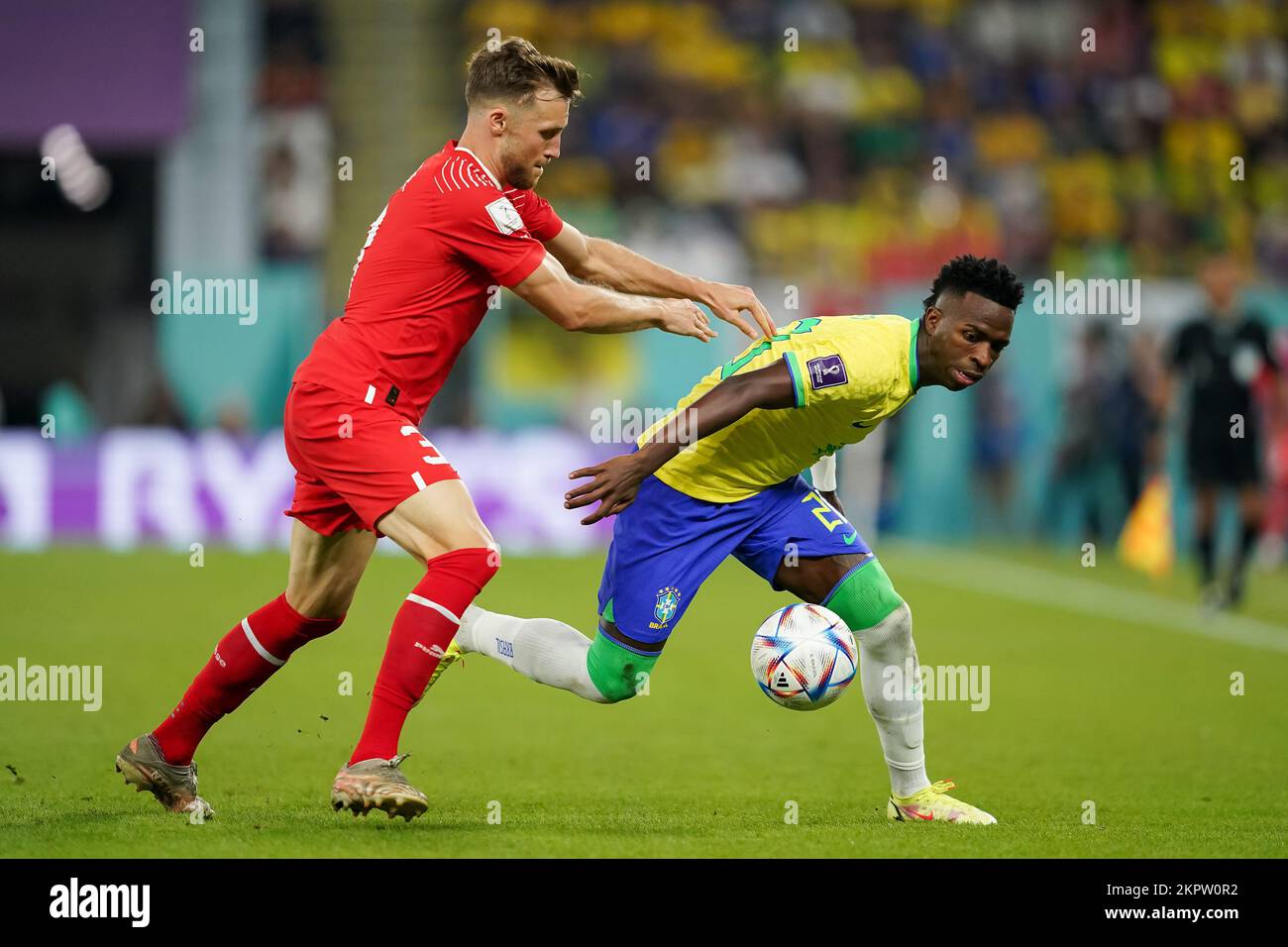 DOHA, QATAR - NOVEMBER 28: Player of Brazil Vinícius Júnior fights for the ball with player of Switzerland Silvan Widmer during the FIFA World Cup Qatar 2022 group G match between Brazil and Switzerland at Stadium 974 on November 28, 2022 in Doha, Qatar. (Photo by Florencia Tan Jun/PxImages) Stock Photo