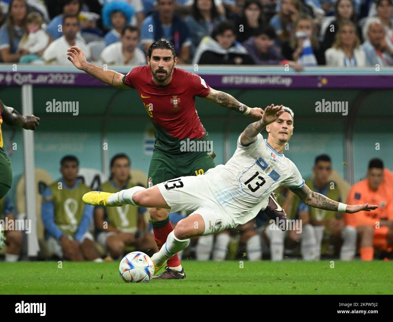 Lusail, Qatar. 28th Nov, 2022. Ruben Neves (L) of Portugal vies with Guillermo Varela of Uruguay during the Group H match between Portugal and Uruguay at the 2022 FIFA World Cup at Lusail Stadium in Lusail, Qatar, Nov. 28, 2022. Credit: Li Ga/Xinhua/Alamy Live News Stock Photo