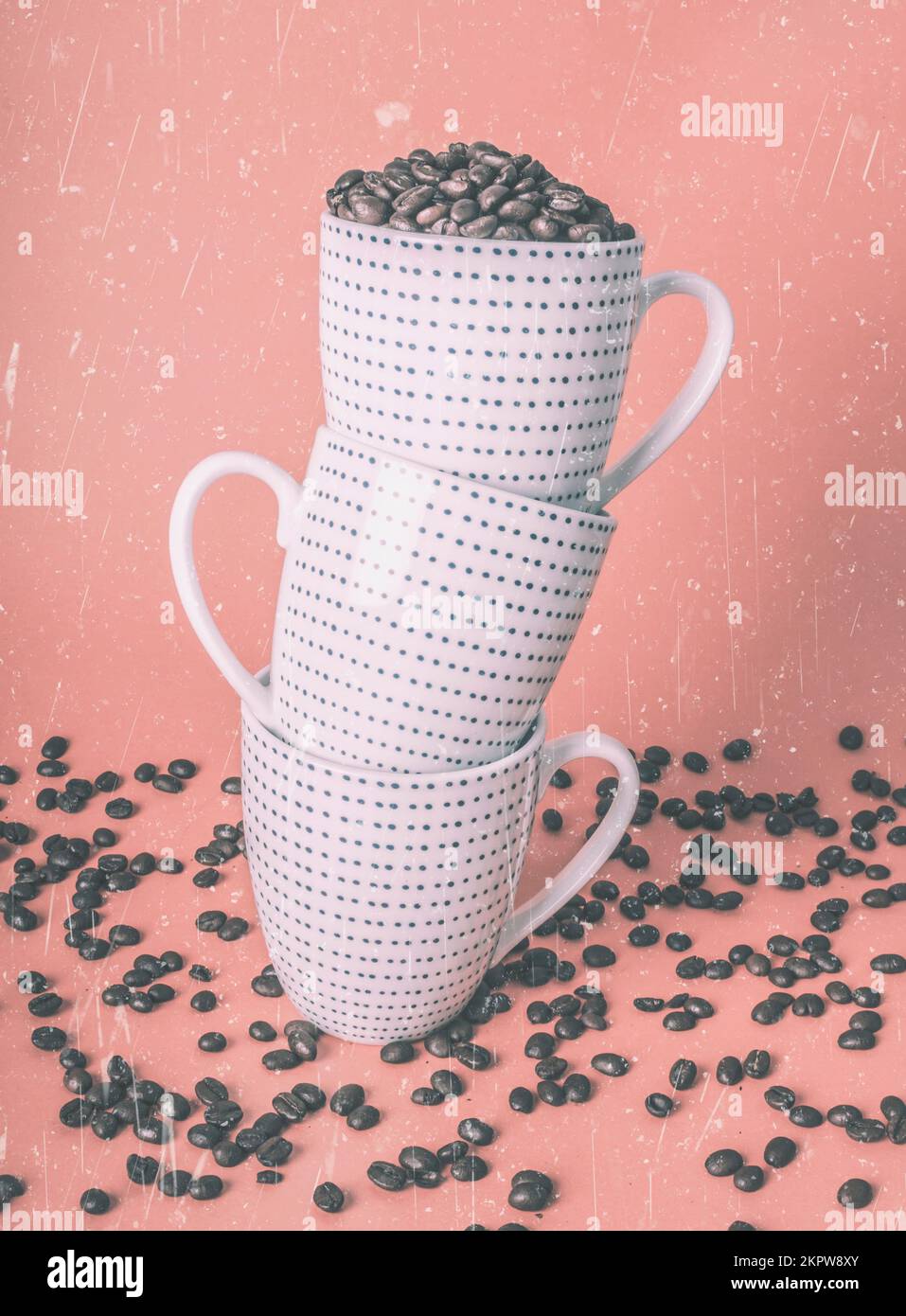 Retro toned coffeehouse design on a stacking of coffee cups with bean spillage Stock Photo Alamy
