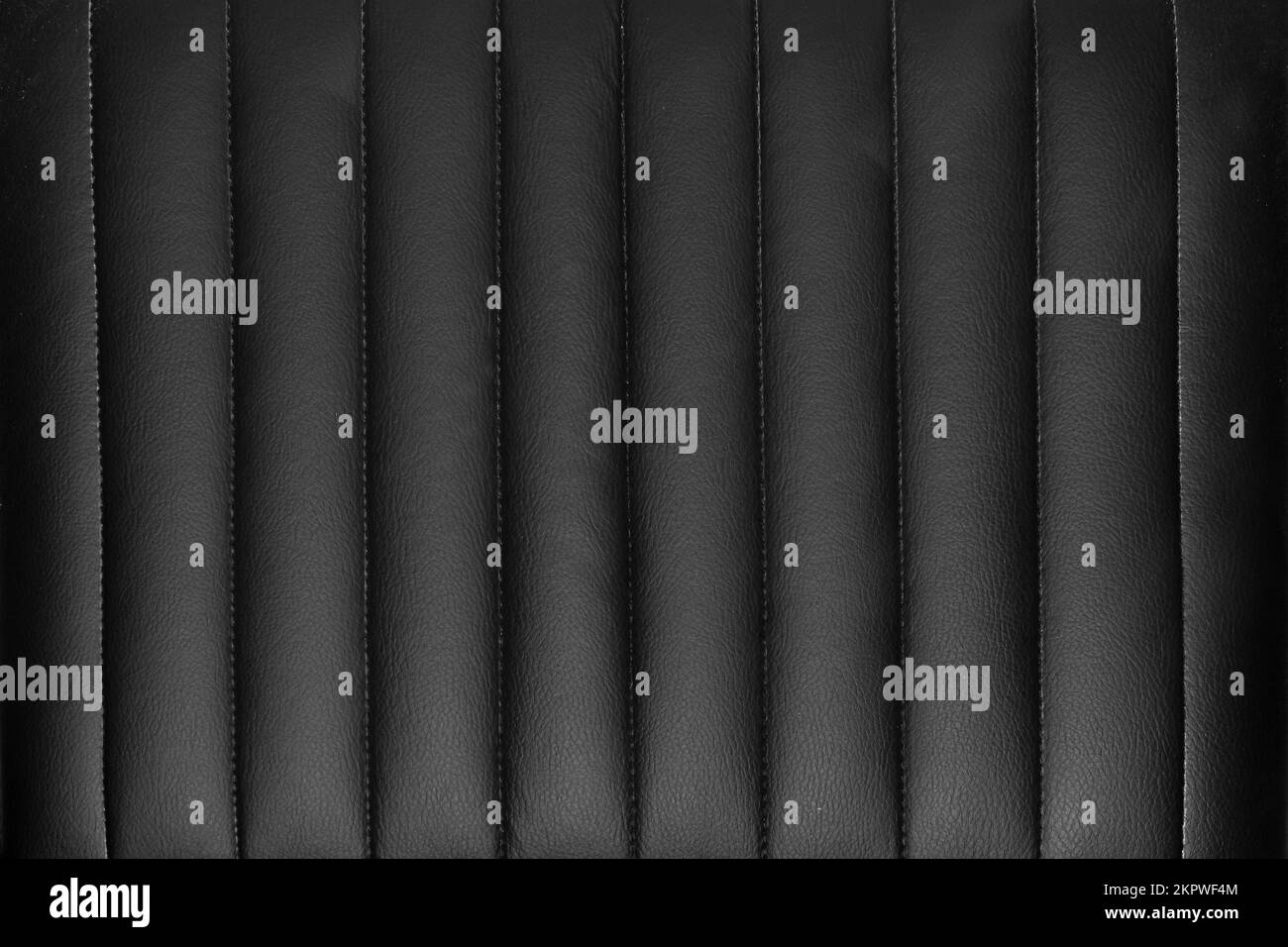Black leather upholstery with vertical stripes pattern background Stock