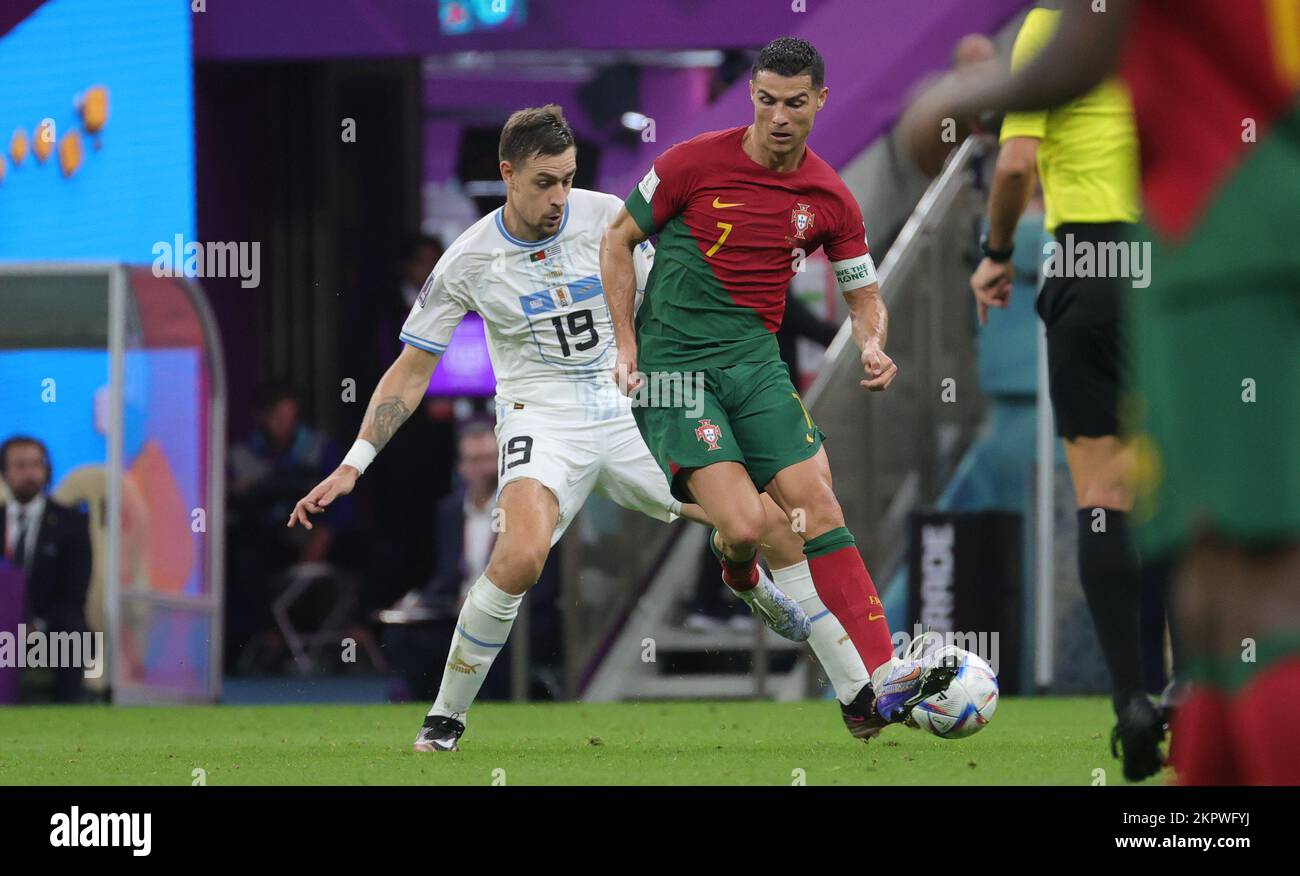 Lusail, Qatar. 28th Nov, 2022. Uruguay's Sebastian Coates and Portuguese Cristiano Ronaldo fight for the ball during a soccer game between Portugal and Uruguay, in Group H of the FIFA 2022 World Cup in Lusail Stadium, in Lusail, State of Qatar on Monday 28 November 2022. BELGA PHOTO VIRGINIE LEFOUR Credit: Belga News Agency/Alamy Live News Stock Photo