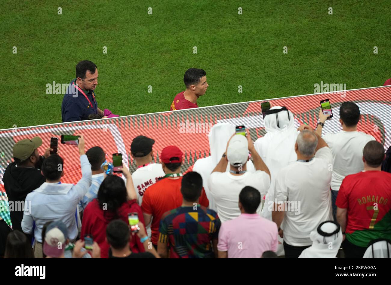 Fans take photographs of Portugal's Cristiano Ronaldo reacts after being substituted for team-mate Goncalo Ramos during the FIFA World Cup Group H match at the Lusail Stadium in Lusail, Qatar. Picture date: Monday November 28, 2022. Stock Photo