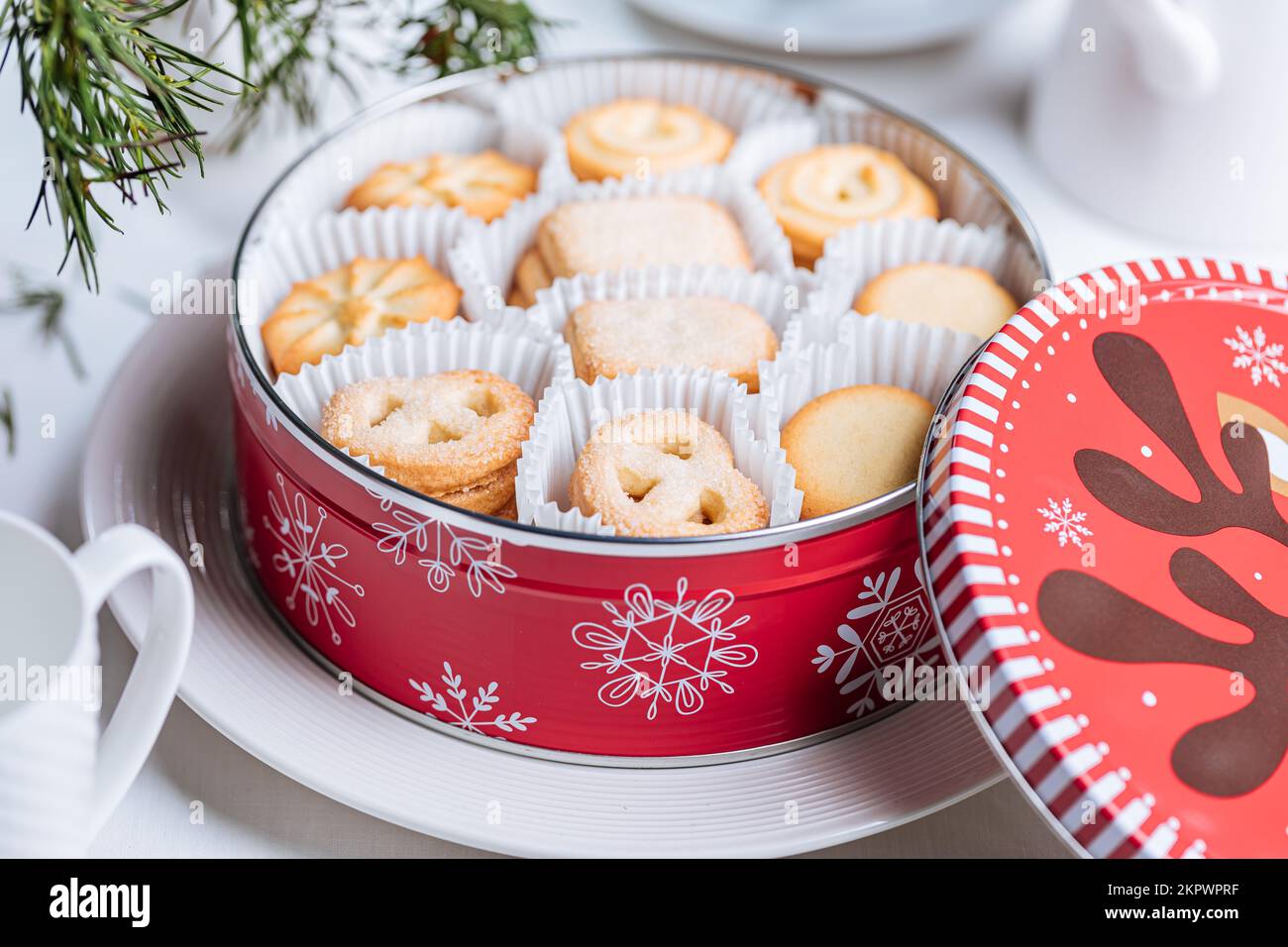 Danish butter cookies in a red Christmas tin box with the snowflakes