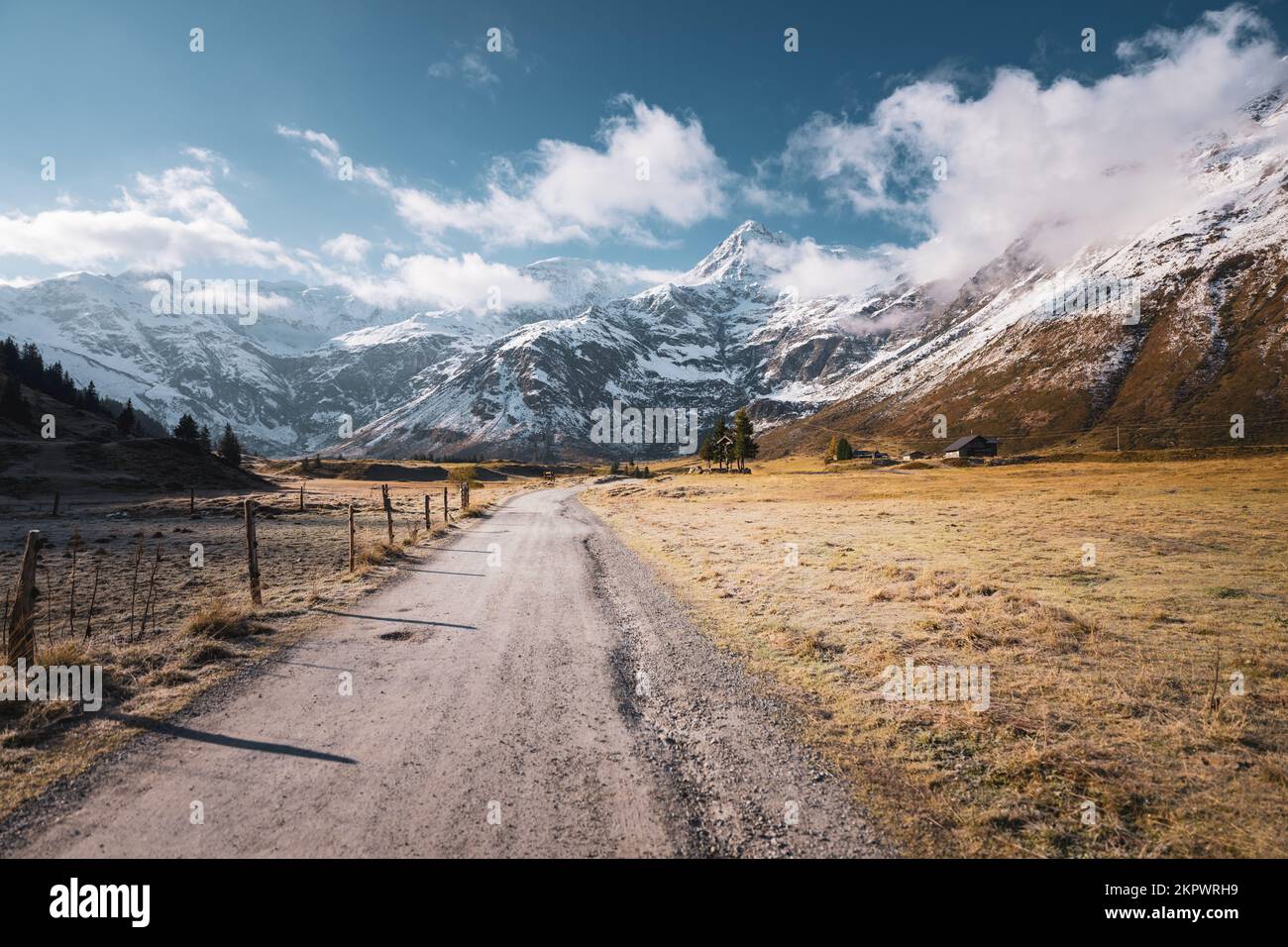 Road through rural alpine landscape in Austrian Alps in autumn, Gastein, Salzburg, Austria Stock Photo