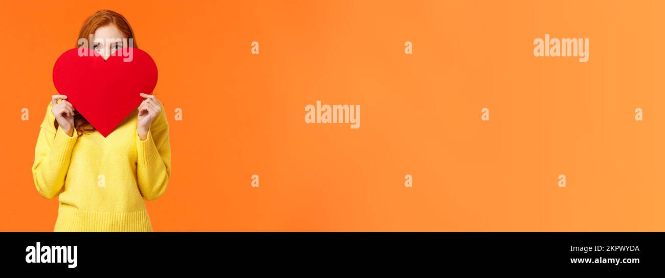 Cute romantic and blushing girl express her feelings on valentines day