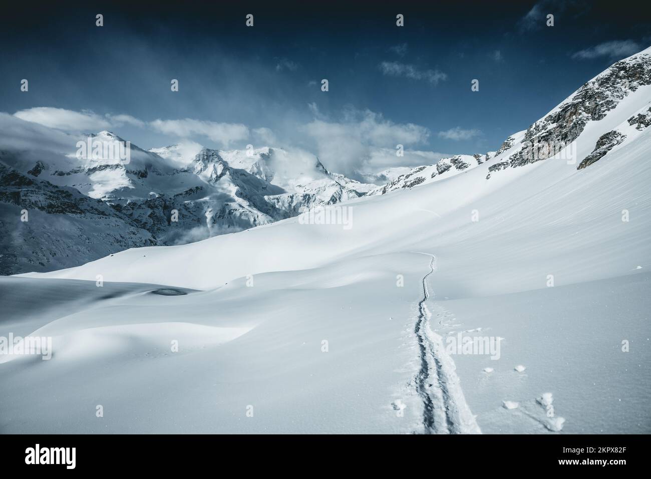 Ski tracks in deep snow in mountains, Austrian alps, Gastein, Salzburg, Austria Stock Photo